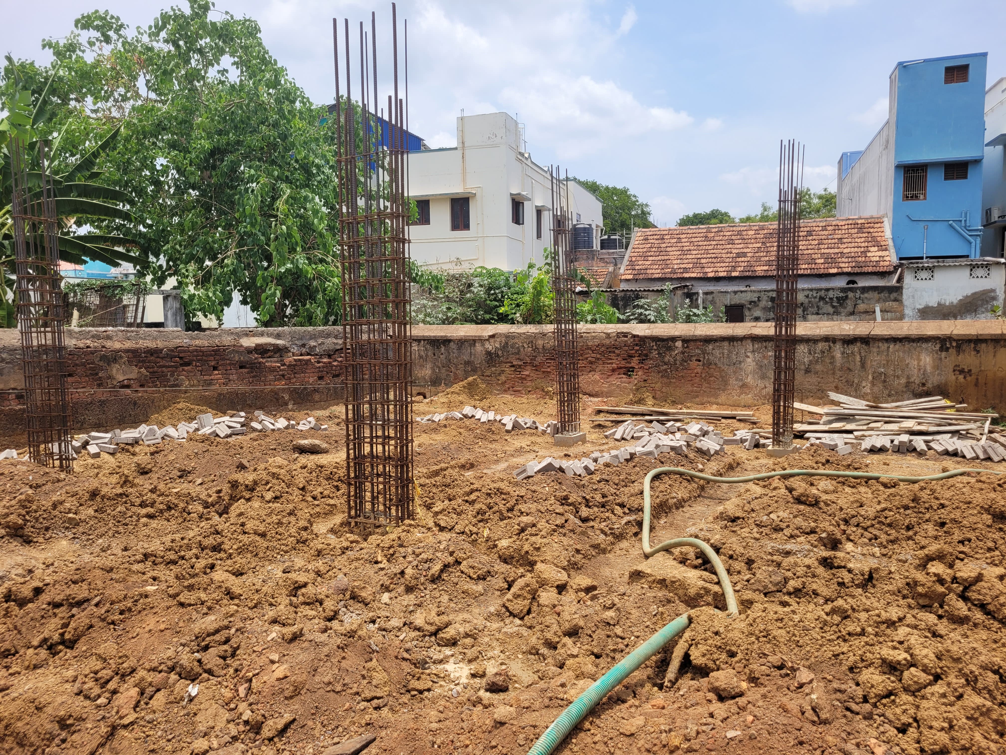 Karupar Sai Residency — site columns rising, April 2026
